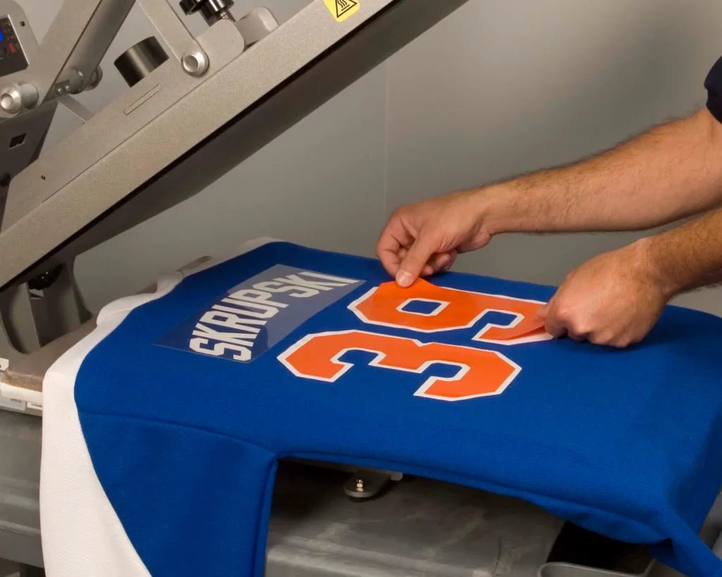Screen Printing Numbers on Jerseys by Heat Transfer